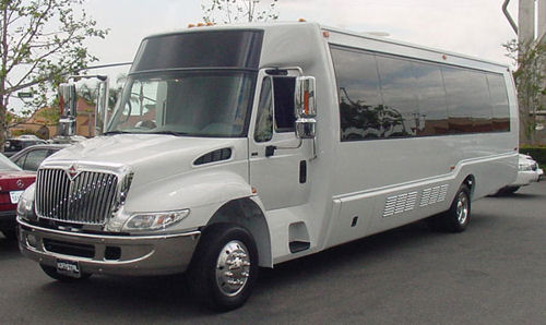 Chauffeur driven silver Party Bus limo hire in UK