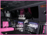 Chauffeur stretched pink limousine hire interior in UK