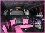 Chauffeur stretch pink limo hire interior in UK